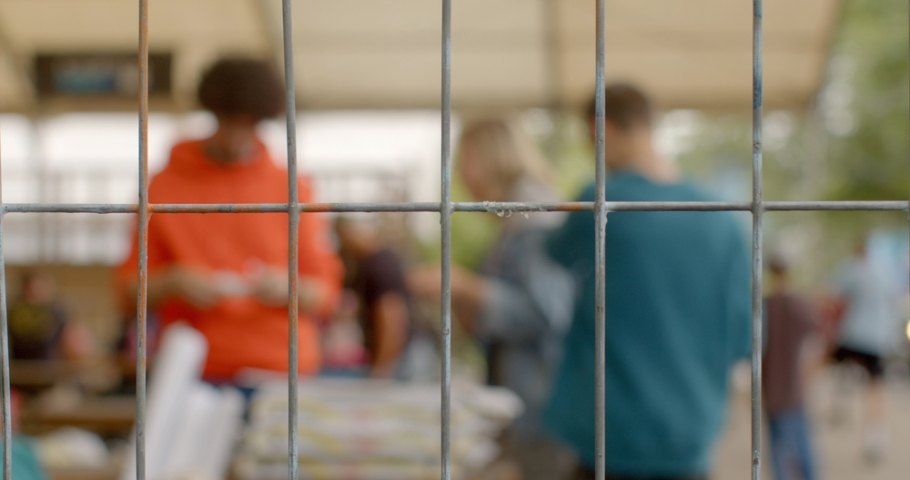 Youth rights in prison. Troubled teen industry to refer to broad range of youth residential programs aimed at struggling teenagers. Rehabilitation behavior modification. Background bokeh behind bars