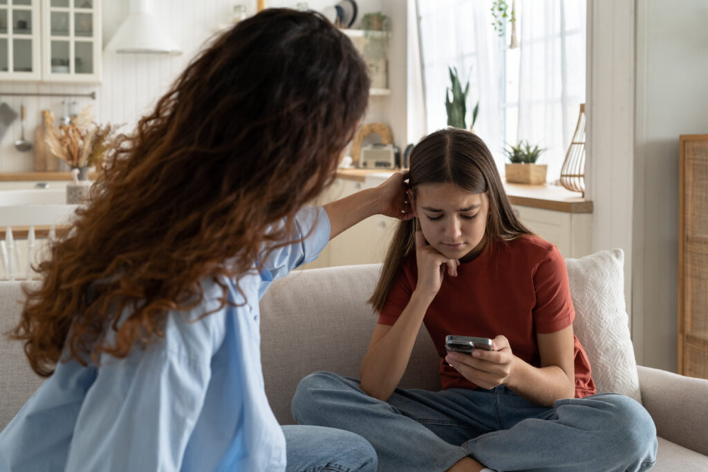 parent talking to teen daughter