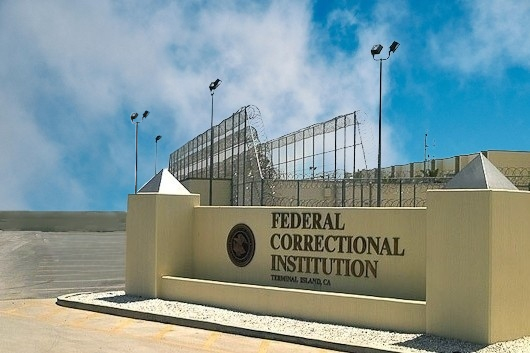 FCI Dublin Front Sign on Sunny Day - File Abuse Lawsuit