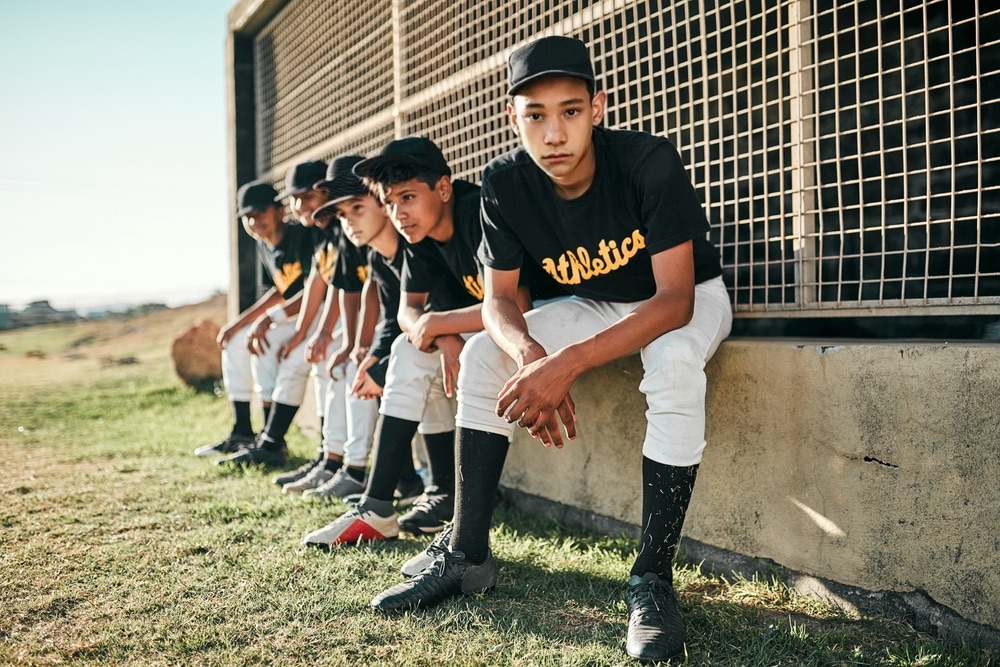 boys travel ball baseball team with concerned teen - File Abuse Lawsuit