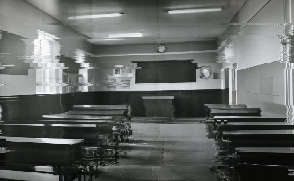 empty school room in old fashion photography style with distortion in black and white representing fear and confusion from sexual abuse that happens at school